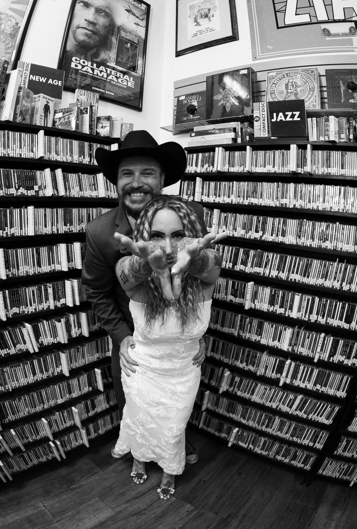 Playful portrait of newlyweds inside a Las Vegas record store